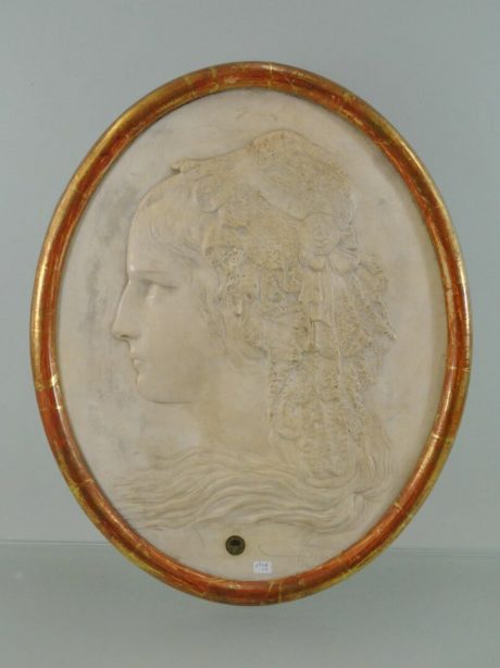 Moulded medallion of a young woman signed by Adam Salomon