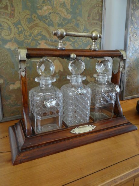 19th century portable liquor Tantalus with three crystal carafes