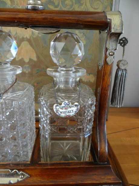 19th century portable liquor Tantalus with three crystal carafes