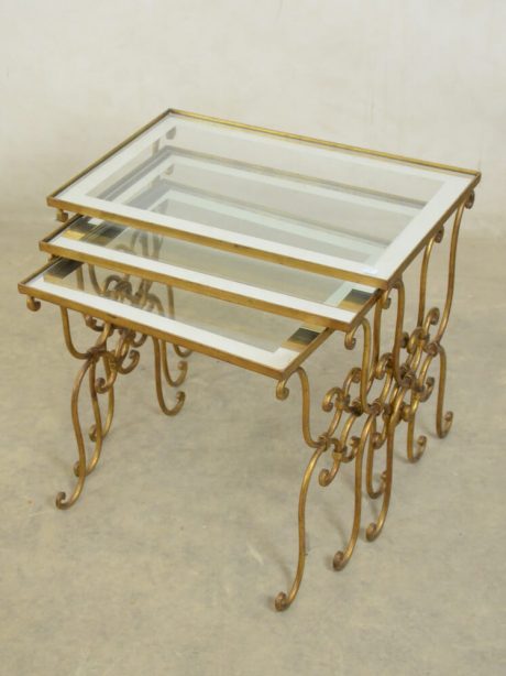 Trio of French gilded brass and glass nest tables from the 1950's