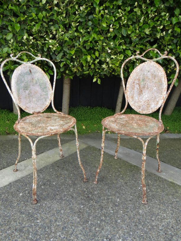 A pair of 19th century French pierced metal garden chairs - European