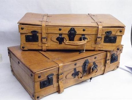 A set of two pig skin leather gentlemans suitcases