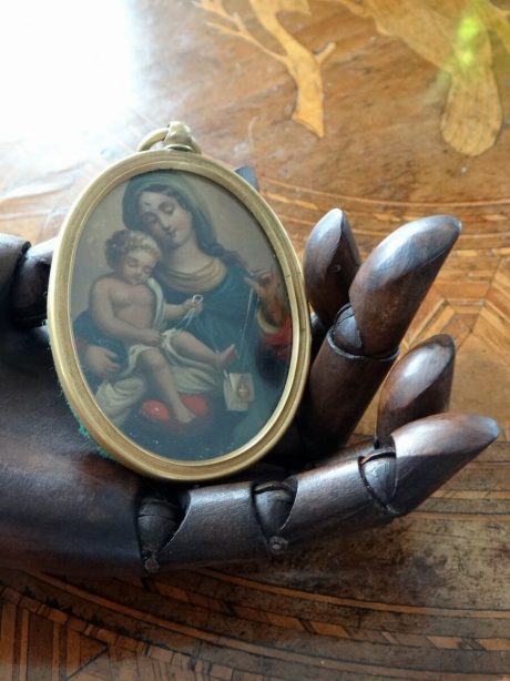 A 19th century religious portrait miniature in oval brass frame