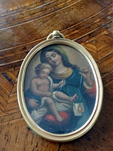 A 19th century religious portrait miniature in oval brass frame