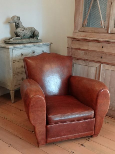 Pair of French 1920's moustache back leather club chairs