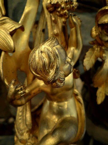 A pair of gilded bronze candlesticks with angelots c.1880