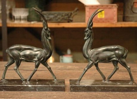 Pair of art deco spelter deers on marble plinths