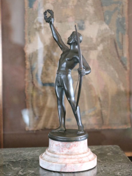 Antique bronze sculpture of an athlete