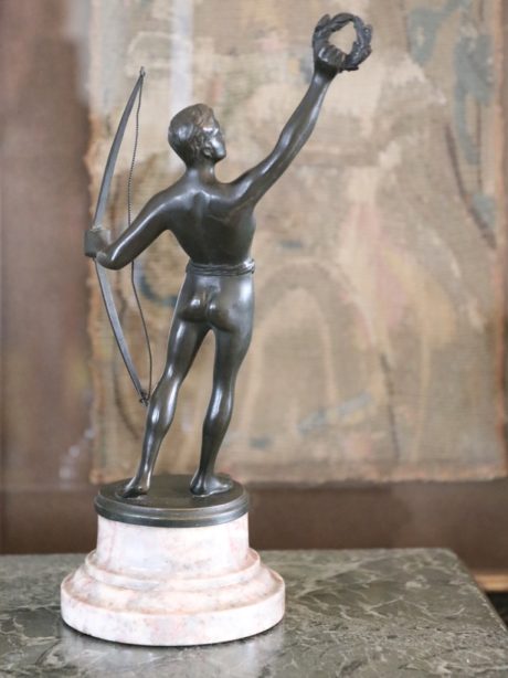 Antique bronze sculpture of an athlete