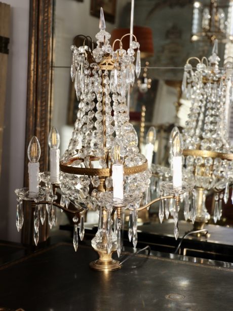 An antique crystal and gilt bronze girandole