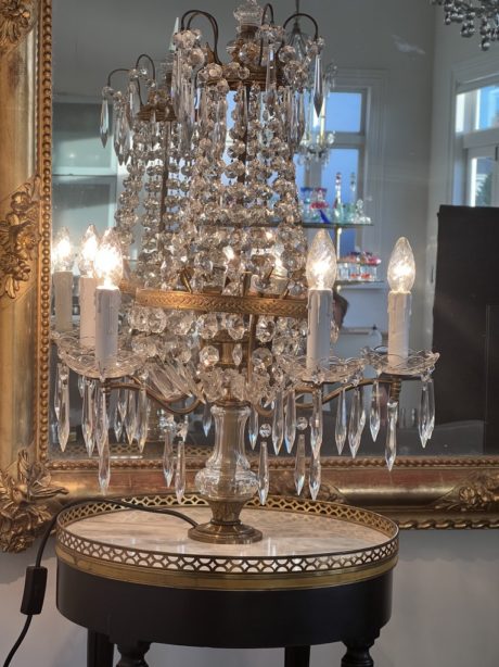 An antique crystal and gilt bronze girandole