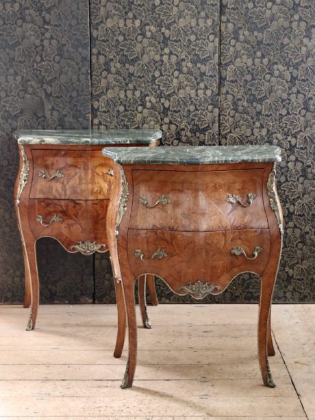 A pair of Louis XV style Bombe bedside drawers