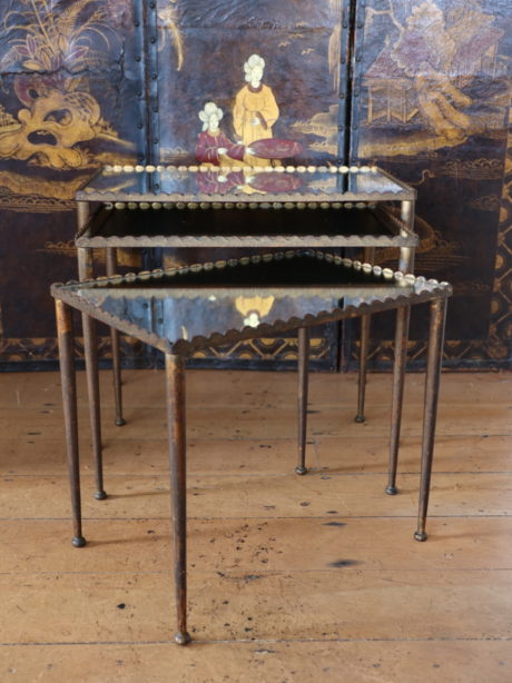 A Mid century trio of French mirrored Nesting tables