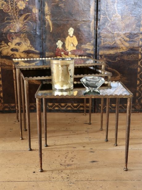 A Mid century trio of French mirrored Nesting tables