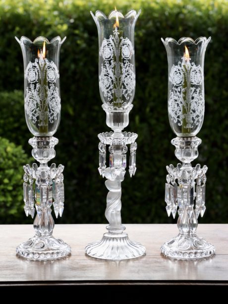 A trio of French crystal Baccarat hurricane lamps