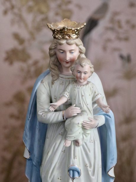 A Bisque porcelain Madonna and child statue