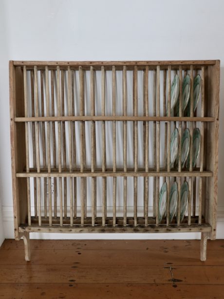 An early Victorian unwaxed pine wall plate rack