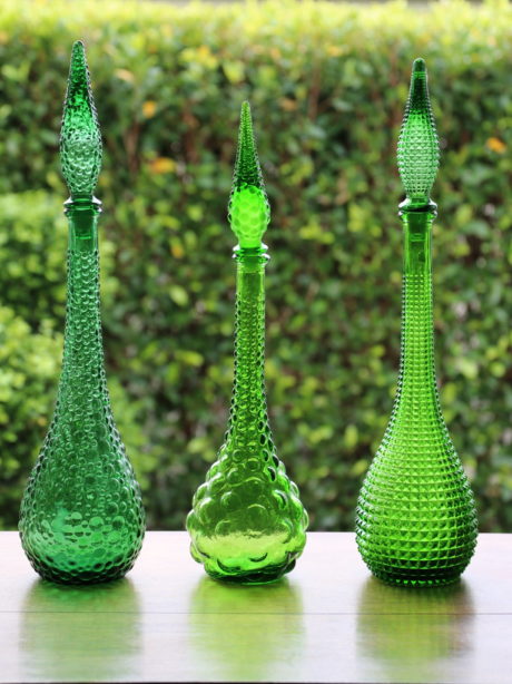 A trio of Italian Empoli glass genie decanters