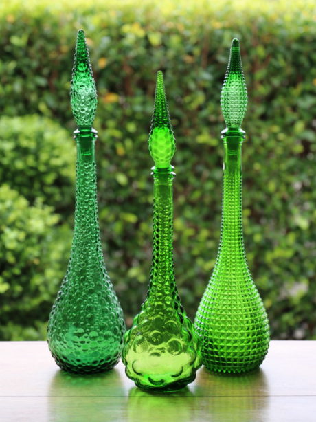 A trio of Italian Empoli glass genie decanters