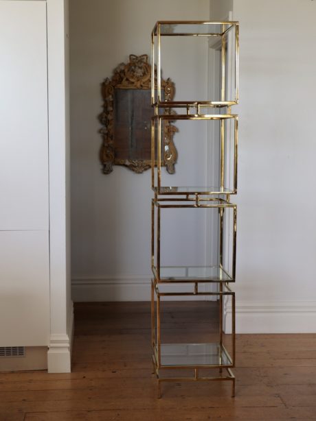 Polished brass and glass etagere shelving unit