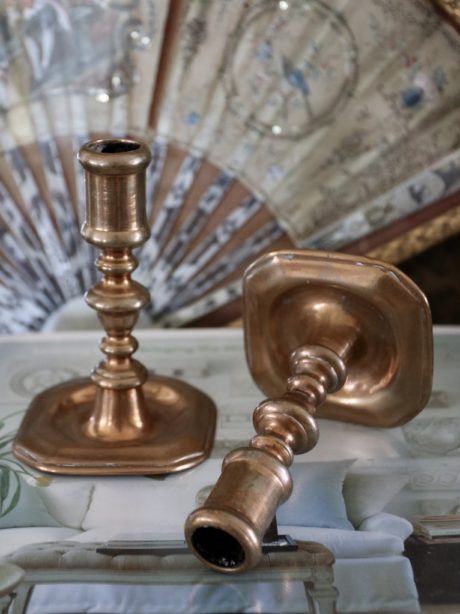 A pair of 18th century French red copper candlesticks