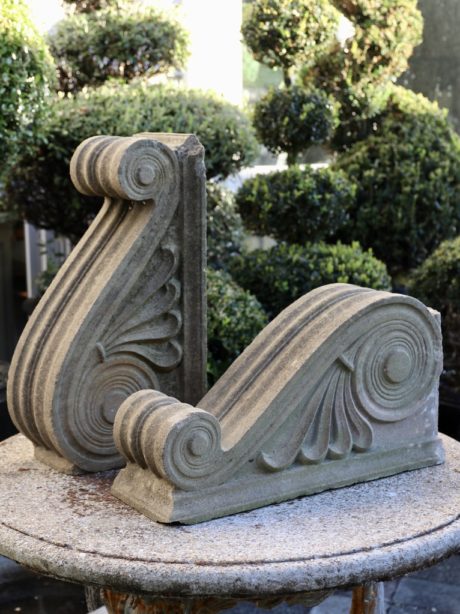 A pair of sculptural composite stone corbels