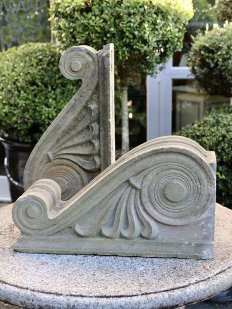 A pair of sculptural composite stone corbels